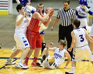 YOUNGSTOWN, OHIO - JANUARY 25, 2014: Trey Staunch #22 of West Middlesex attempts to pass the ball after grabbing a rebound away from Jacob Burns #14, Kyle Dixon #21 and Nick Gajdos #3 of Poland during the first half of Sunday evenings game at Covelli Centre. (Photo by David Dermer/Youngstown Vindicator)