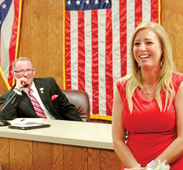 Austintown Township Trustee Lisa Oles and fellow Trustee Jim Davis laugh during Oles’ last meeting as a township trustee Monday night. Citizens, politicians and civic groups were on hand to remember her time as a township official.