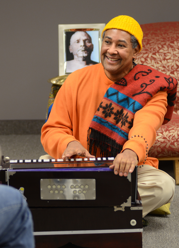 Katie Rickman | The Vindicator.Kedar Acharyaji chants as he plays a harmonium at a chanting and meditation program at Bella Nitesh on Jan. 14, 2015. Over a dozen people gathered to hear Acharyaji speak about finding inner peace and power within.