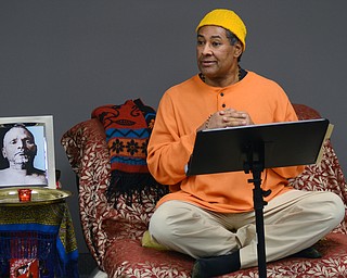 Katie Rickman | The Vindicator.Kedar Acharyaji speaks at a chanting and meditation program at Bella Nitesh on Jan. 14, 2015 with a portrait of Bhagawan Nityananda (a Siddha Guru or Profected Master) to his left. Over a dozen people gathered to hear Acharyaji speak about finding inner peace and power within..