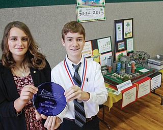Paige Brockway and Matthew Rossi, eighth-grade students at Holy Family School in Poland, hold the second-place trophy from the Future City Competition. Brockway and Rossi, along with a group of more than 20 other sixth-, seventh-, and eighth-grade Holy Family students, chose Youngstown as the city they would design in its future form. The competition asks participants to design a city, research a solution to a social problem and then build a model of the city using recycled materials. This was Holy Family’s best year in the state competition.