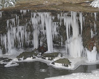        ROBERT K. YOSAY  | THE VINDICATOR..Lantermans Mill Falls -  bathed in ice and water.. forms.. stalactites... nearby as water freezes.....the With tempertatures hovering around zero Mill Creek Metroparks has started its annual ice show by nature as ice forms on creeks to lakes to waterfalls