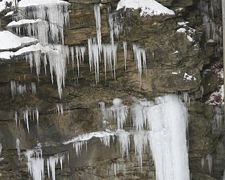        ROBERT K. YOSAY  | THE VINDICATOR..Lantermans Mill Falls -  bathed in ice and water.. forms.. stalactites... nearby as water freezes.....the With tempertatures hovering around zero Mill Creek Metroparks has started its annual ice show by nature as ice forms on creeks to lakes to waterfalls