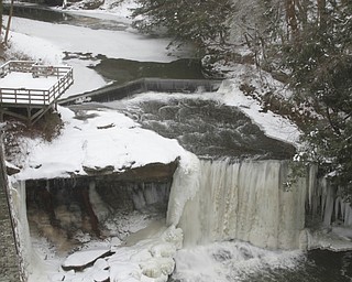        ROBERT K. YOSAY  | THE VINDICATOR..Lantermans Mill Falls -  bathed in ice and water.. forms.. stalactites... nearby as water freezes.....the With tempertatures hovering around zero Mill Creek Metroparks has started its annual ice show by nature as ice forms on creeks to lakes to waterfalls