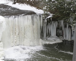        ROBERT K. YOSAY  | THE VINDICATOR..Lantermans Mill Falls -  bathed in ice and water.. forms.. stalactites... nearby as water freezes.....the With tempertatures hovering around zero Mill Creek Metroparks has started its annual ice show by nature as ice forms on creeks to lakes to waterfalls