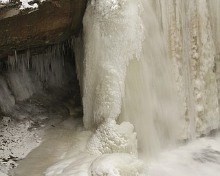        ROBERT K. YOSAY  | THE VINDICATOR..Lantermans Mill Falls -  bathed in ice and water.. forms.. stalactites... nearby as water freezes.....the With tempertatures hovering around zero Mill Creek Metroparks has started its annual ice show by nature as ice forms on creeks to lakes to waterfalls