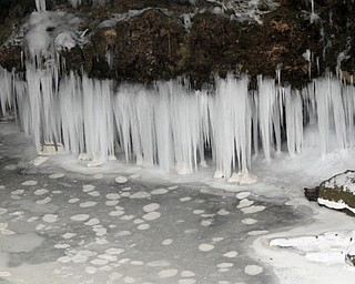        ROBERT K. YOSAY  | THE VINDICATOR..Lantermans Mill Falls -  bathed in ice and water.. forms.. stalactites... nearby as water freezes.....the With tempertatures hovering around zero Mill Creek Metroparks has started its annual ice show by nature as ice forms on creeks to lakes to waterfalls