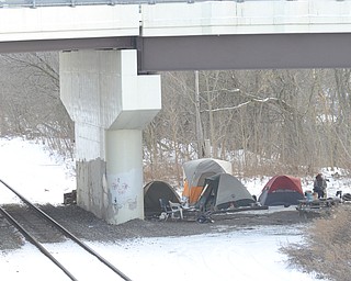 Katie Rickman  | The Vindicator.A small "tent city" under Marshall Street Bridge where several homeless people live is viewed from West Front Street in Youngstown on January 15, 2015.