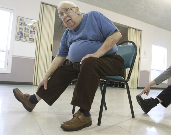 William D. Lewis the vindicator Tom Kress of Niles participates in a chair excerise program at the Niles Senior Center 1-16-15.