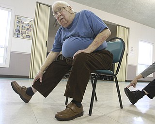 William D. Lewis the vindicator Tom Kress of Niles participates in a chair excerise program at the Niles Senior Center 1-16-15.