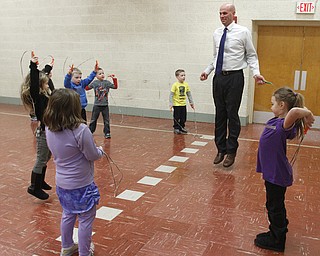        ROBERT K. YOSAY  | THE VINDICATOR..Principal James Goske not to be outdone by a kindergarten class  as he jumps rope with the class..PE classes at Stadium Drive  Elementary in Boardman School are participating in a jump-roping /hula-hoope  event to raise money for the American Heart Association.