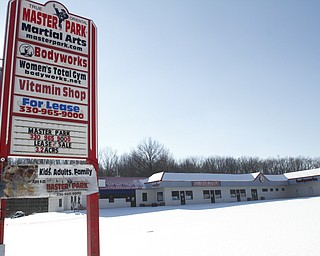        ROBERT K. YOSAY  | THE VINDICATOR..Moon Park, owner of the martial arts company Master Park , has lost one of his three properties. A property that has been vacant for more than a decade, and an eyesore to Austintown residents, was bought in a sheriffÕs sale by Talmer Bank last week. ParkÕs two other properties were recalled from the sale because he filed bankruptcy...CHECK ONE.