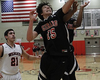 Girard's Dylan O'Hara pulls in a rebound during the first half of Friday nights matchup against Struthers at Struthers High School.   Dustin Livesay  |  The Vindicator  1/30/15  Struthers High School.