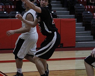 Girard's Dylan O'Hara (15) saves a ball from going out of bounds during the first half of Friday nights matchup against Struthers at Struthers High School.   Dustin Livesay  |  The Vindicator  1/30/15  Struthers High School.