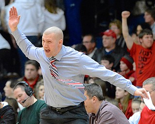 Jeff Lange | The Vindicator  Canfield's head coach Todd Muckleroy coaches his boys during second quarter action of January 30th's game against Poland.