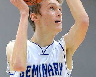 Jeff Lange | The Vindicator  Poland's Matt Baker prepares to take a two-point shot in the during second period action against Canfield at Poland High School, Friday night.
