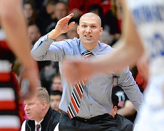 Jeff Lange | The Vindicator  Canfield's head coach Todd Muckleroy coaches his boys during second quarter action of January 30th's game against Poland.