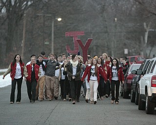        ROBERT K. YOSAY  | THE VINDICATOR...Cardinal Mooney High SchoolÕs colors are red and gold, but about 100 students donned white T-shirts Tuesday morning to show support for their ousted principal..John Young, principal since 2011, was terminated last week and the Catholic Diocese of Youngstown hasnÕt revealed the reason, calling it a personnel matter.