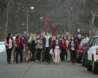        ROBERT K. YOSAY  | THE VINDICATOR...Cardinal Mooney High SchoolÕs colors are red and gold, but about 100 students donned white T-shirts Tuesday morning to show support for their ousted principal..John Young, principal since 2011, was terminated last week and the Catholic Diocese of Youngstown hasnÕt revealed the reason, calling it a personnel matter.