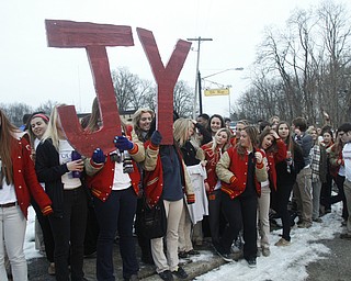        ROBERT K. YOSAY  | THE VINDICATOR...Cardinal Mooney High SchoolÕs colors are red and gold, but about 100 students donned white T-shirts Tuesday morning to show support for their ousted principal..John Young, principal since 2011, was terminated last week and the Catholic Diocese of Youngstown hasnÕt revealed the reason, calling it a personnel matter.