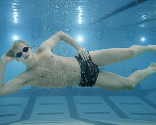 Katie Rickman | The Vindicator.Connor Brady a senior at Canfield High School poses for a photo in the pool at YSU on Wednesday, Jan. 21, 2015.  Brady jokes that the pose is called the "...ladies..." pose.
