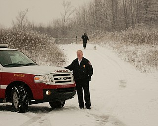        ROBERT K. YOSAY  | THE VINDICATOR..Timber Run Drive where it dead-ends into the emergency route off of Herbert Road and connecting /Gibson Road, off of state Route 46.The road was never finished by the city or the twp developers - do to turnpike construction this summer the road will finally connect .. Timber Run Drive and where that ends we meet with Fire Chief Don Hutchison...