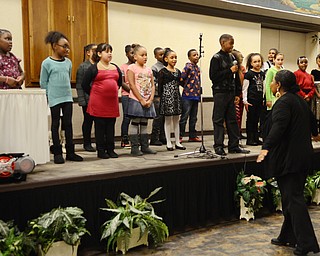 Katie Rickman | The Vindicator.Students from Williamson Elementary School’s “Voices of Hope” gospel choir sang  “Oh Happy Day” and were directed by Angela McCoy the Choir Director during the 2015 State of the District Address at Our Lady of Mount Carmel Church on Thursday, Jan. 22, 2015.