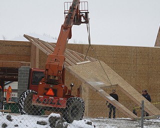  .          ROBERT  K. YOSAY | THE VINDICATOR..The Canfield Library is taking shape  as The new $5 million library is being built . on the same site as the previous library, which was demolished this fall...The construction schedule calls for the new building should be done in late 2015, ..-30-
