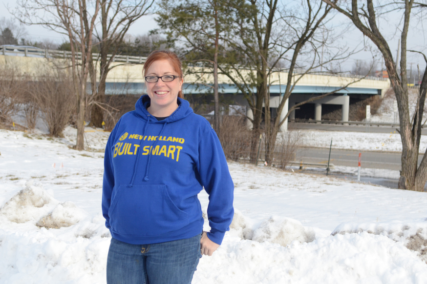 Katie Rickman | The Vindicator.Nichole Miner poses for a photo near the bridge on 224 in Canfield on Friday, January 23, 2015. Miner’s business will be greatly effected by the work on the bridge and one of the signs has already been taken down.