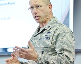 Jeff Lange | The Vindicator  910th Maintenance Group Commander Col. David Post speaks about the Youngstown Air Reserve Base in Vienna, Thursday afternoon during the Air Force Community Partnership Program meeting held on the base.