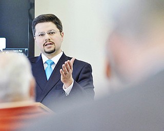 Jeff Lange | The Vindicator  John Rossi of the Regional Chamber Foundation speaks to members of the Youngstown Military Affairs Council during Thursday afternoon's AFCPP meeting at the Youngstown Air Reserve Station in Vienna.