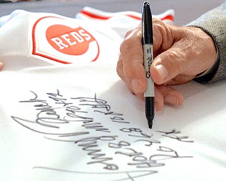 Jeff Lange | The Vindicator  Former Major League Baseball catcher for the Cincinnati Reds and National Baseball Hall of Fame member Johnny Bench signs a replica jersey for the auction that took place after the breakfast. His signed jersey sold for $2,100 to a very surprised Austintown Fitch student Blake Benyo who said "I didn't know I'd be leaving here with something so treasurable."