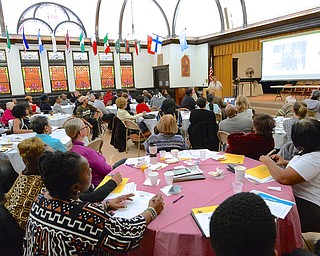 Jeff Lange | The Vindicator  The attendees of the MLK Community Workshop at the First Presbyterian Church in Youngstown listen as Jaladah Aslam of the MLK Committee speaks about Martin Luther King Jr.'s impact during the civil rights movement, Monday morning.