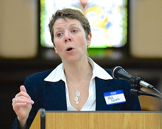 Jeff Lange | The Vindicator  Barbara Ewing of the Youngstown Incubator answers questions about benifitting local business during the MLK Community Workshop at the First Presbyterian Church in Youngstown, Monday morning.