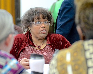 Jeff Lange | The Vindicator  Brenda Richardson of Youngstown discusses with members of her table the strengths and weaknesses that can help or hinder the ability to live civilly in Mahoning County, Monday morning at the First Presbyterian Church in Youngstown during the MLK Community Workshop.