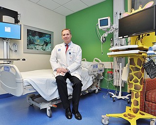 Jeff Lange | The Vindicator  Dr. Scott Beichner, Regional Director of the Mahoning Valley Hospitalist Program sits on the bed in one of the rooms in the Pediatric Unit at St. Joseph Warren Hospital, Jan. 21st.