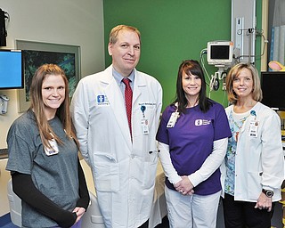 Jeff Lange | The Vindicator  Assistant nurse manager Nicole Mansky (far left), Melissa Monte nurse manager (right) and Sherry Herriman RN (far right) stand in one of the rooms with new technology, Wednesday, January 21st at St. Joseph Warren Hospital.