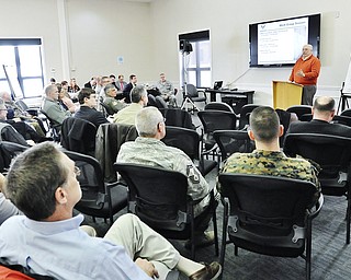 Jeff Lange | The Vindicator  KSU consultant George Brown speaks during Thursday's Air Force Community Partnership Program meeting held at the Youngstown Air Reserve Station in Vienna.