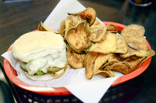 The Super-Hero Burger featuring a 1⁄4 lb burger with grilled peppers, grilled onions, A-1 Sauce, and provolone
cheese with a side of sweet potato chips.