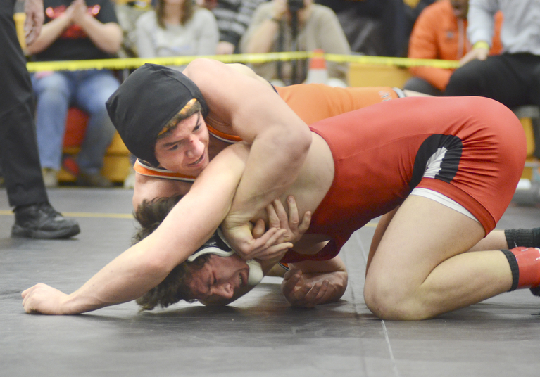 Katie Rickman | The Vindicator.Howland's Jordan Radich  wrestles Salem's Jesse Slocum  during the EOWL Championship match at Crestview High School Saturday, Feb. 7, 2015. Poullas won the match. Radich won the match.