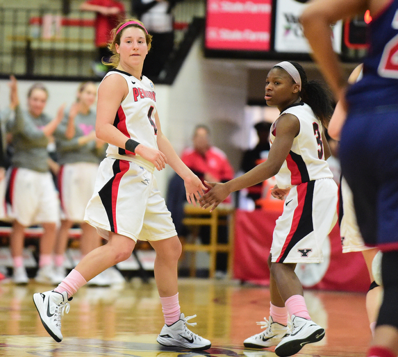 YOUNGSTOWN, OHIO - FEBRUARY 7, 2015: Nikki Arbanas #4 of YSU is congratulated by Indiya Benjamin #3 after making a three point shot during the 1st half of their game at Beeghly Center Saturday afternoon. (photo by David Dermer/Youngstown Vindicator)