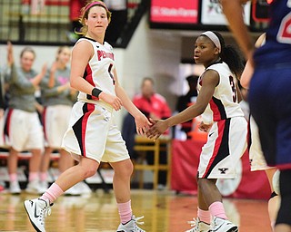 YOUNGSTOWN, OHIO - FEBRUARY 7, 2015: Nikki Arbanas #4 of YSU is congratulated by Indiya Benjamin #3 after making a three point shot during the 1st half of their game at Beeghly Center Saturday afternoon. (photo by David Dermer/Youngstown Vindicator)
