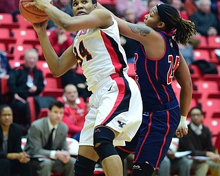 YOUNGSTOWN, OHIO - FEBRUARY 7, 2015: Latisha Walker #34 of YSU looks to the basket while being tightly guarded by Kendyl Nunn #25 of UIC during the 1st half of their game at Beeghly Center Saturday afternoon. (photo by David Dermer/Youngstown Vindicator)