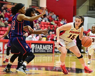 YOUNGSTOWN, OHIO - FEBRUARY 7, 2015: Heidi Schlegel #15 of YSU dribbles to the basket while be defended by Imani Moore #22 and Ruvanna Campbell #12 of UIC during the 1st half of their game at Beeghly Center Saturday afternoon. (photo by David Dermer/Youngstown Vindicator)