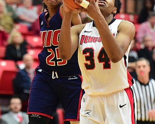 YOUNGSTOWN, OHIO - FEBRUARY 7, 2015: Latisha Walker #34 of YSU puts up a shot while Kendyl Nunn #25 of UIC goes for the block during the 1st half of their game at Beeghly Center Saturday afternoon. (photo by David Dermer/Youngstown Vindicator)