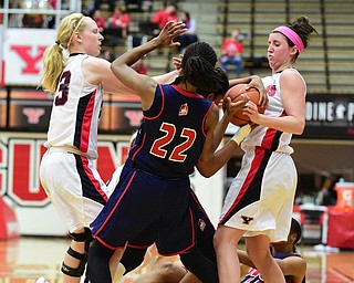YOUNGSTOWN, OHIO - FEBRUARY 7, 2015: Kendyl Nunn #25 and Imani Moore #22 of UIC battle for a loose ball with Sarah Cash #23 and Kelsea Newman #13 of YSU after YSU turnover during the 2nd half of Saturday afternoons game at Beeghly Center. (photo by David Dermer/Youngstown Vindicator)