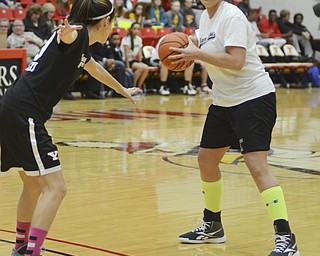 Katie Rickman | The Vindicator.Team Hope's Jess Shields of Youngstown Police Department (#40) passes around Team Kings' Lisa Modelski of the Mahoning County Educational Center (#20).