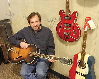 Thomas Diggins, who opened Hootenanny Vintage Guitars at 14 N. Phelps St. in downtown Youngstown in 2009 but closed it in 2011 due to family issues, plans to reopen the store in March after Youngstown State University students return from spring break. Diggins is a professor of evolution and ecology at YSU.