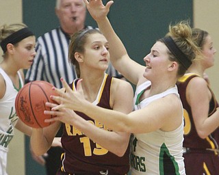 William D Lewis the Vindicator SR's Madison Durkin(13) keeps the ball cfrom West Branch's Melinda Trimmer(14) during Monday action at WB.