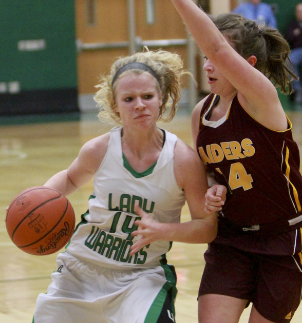 William D Lewis The Vindicator west Branch's Melinda Trimmer(14) drives around SR's Jordan Youngs(14).